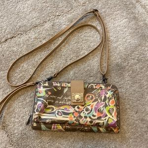 The Sak Sakroots phone purse crossbody.